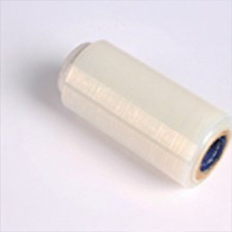 A narrow roll of clear banding film lying on its side, wound on a blue core.