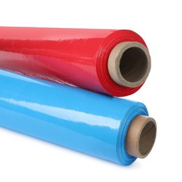 Two rolls of stretch film, one red and one blue, lying on a white background.