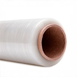 A roll of clear stretch film lying on its side, its kraft cardboard core facing the camera.