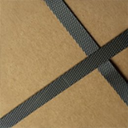Two black strapping bands crossed over the top of a kraft carton.